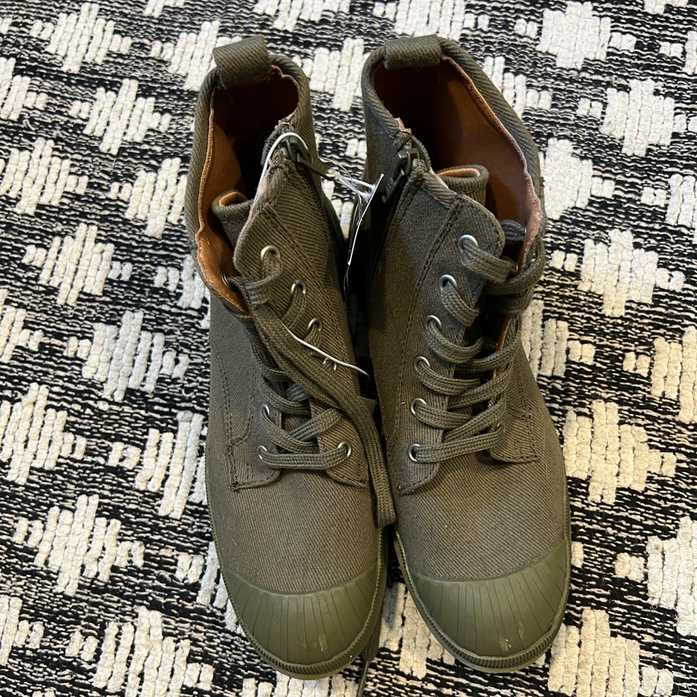 Small scuffs on back from storage, but never worn